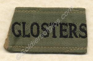 Black on khaki drill shoulder title. Manufactured