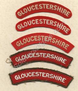 White on red cloth shoulder titles, (two patterns)