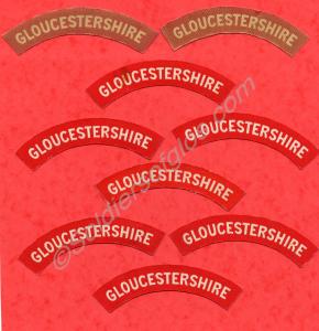 White on red cloth shoulder titles.The Gloucesters
