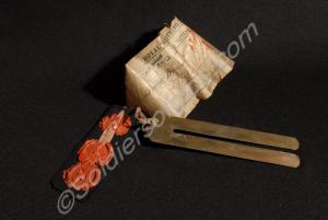 Brass button stick. 1898-1929.