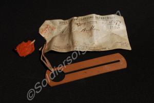 Red composite button stick. 1915-1921.