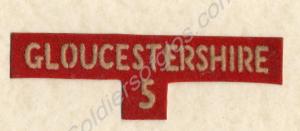 White on red cloth shoulder title. 5th Gloucester