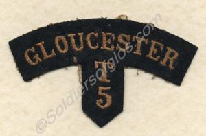 Gold on black cloth shoulder title. Thought to be