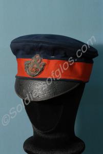 Forage cap with '23' within a bugle badge. 23rd Ro