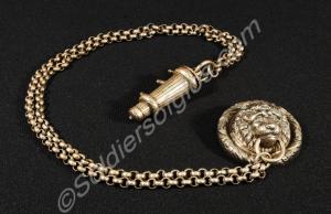 Officer's whistle and chain from shoulder belt.c.