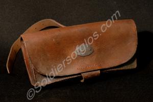 Brown leather ammunition pouch with white metal ov