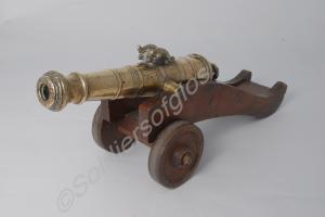 Brass timing gun on wooden carriage. Date unknown.