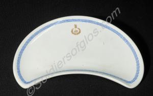 Half-moon salad plate, decorated with a blue borde