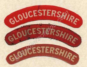 White on red cloth shoulder titles, (two patterns)