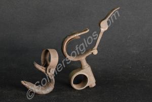 Two rifle clips for carrying a rifle on a cycle by