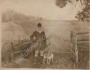 Huntsman with two terriers. c. 1914.