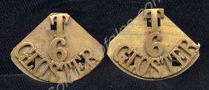 Pair of brass shoulder titles with back plates.  6