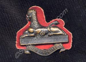 Forage cap badge in blackened bronze. "South Afric