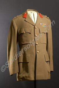 Khaki service dress jacket with medal bars. Worn b