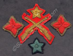 Four proficiency badges; cloth Marksman's badge wi