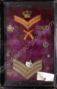 Case of various badges and chevrons. The Glouceste