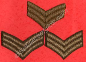 Three sets of khaki Sergeant's chevrons. Glouceste