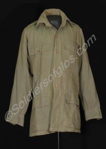 Khaki cotton bush shirt. With four pockets at the