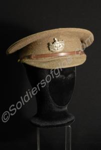 Khaki serge peaked cap with white metal front badg