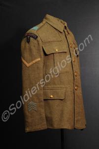 Khaki service jacket. With four blue overseas serv