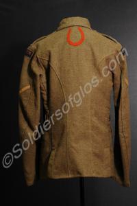 Khaki service jacket. With four blue overseas serv