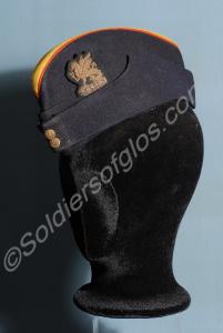 Officer's blue side cap with red piping and primro