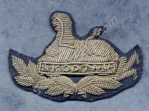 Officer's gold wire embroidered cap badge sewn on