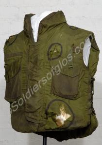 Green flak jacket. Worn by Lieutenant T.G. Ongley