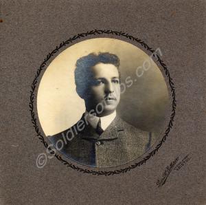Mounted photograph of man in civilian dress. Poss