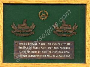 Framed badges belonging to H.R.H. Queen Mary. Pres