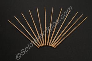 Six pairs of wooden drum sticks.