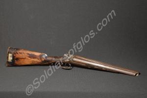 Sawn-off double-barrelled shot gun. Recovered by t