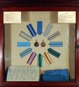 Display of United Nations medal ribbons. Two repre