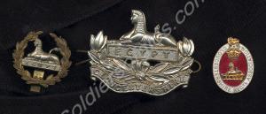 Three badges; white metal Front Badge, large brass