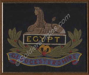 Embroidered silk square with a front badge of the