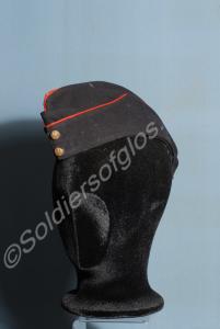 Officer's blue field cap with red piping and white