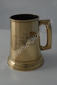 Silver tankard with a glass base. Engraved with th