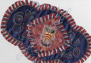 Blue embroidered silk table mat. Gloucestershire R
