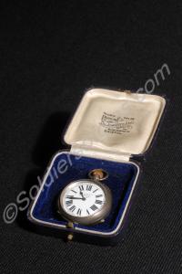 Small silver pocket watch in box. Presented to Col