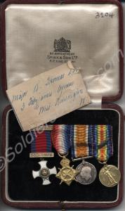 Group of four miniature medals; Distinguished Serv