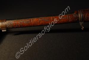 Detail of stock near muzzle, left hand side. Mause
