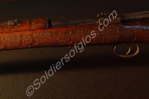 Detail of stock near breech, gun sight and trigger