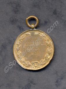 Bronze shooting medal with the inscription 'Platoo