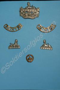 Six Gloucestershire Regiment badges mounted on car