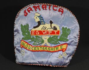 Embroidered tea cosy. Decorated with Gloucestershi