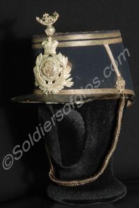 Kepi with badge, plume holder and chin strap. Worn