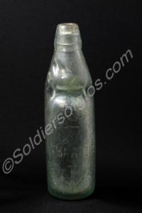 N.A.A.F.I. glass drink bottle with a marble in the