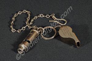 Two whistles; one is the 'Acme Thunderer' with pea