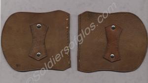 One pair of leather epaulettes worn with pullover.