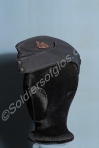 Officer's blue field cap with front badge on red c